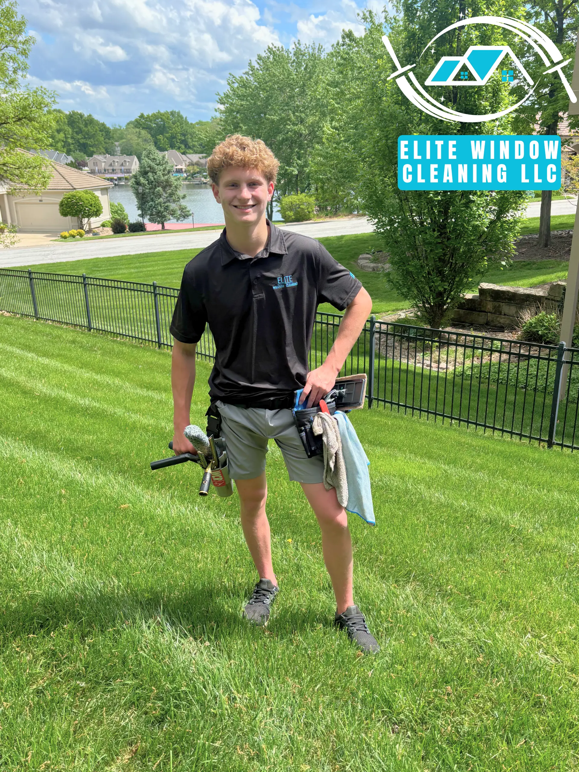 Chandler Zuydendorp, owner of Elite Window Cleaning, standing with tools on a residential property in Lee’s Summit, MO