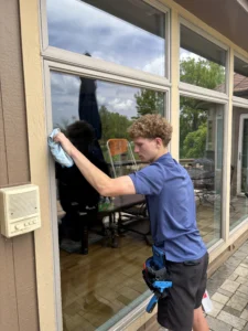 window cleaning in progress on a residential home in kansas city, missouri