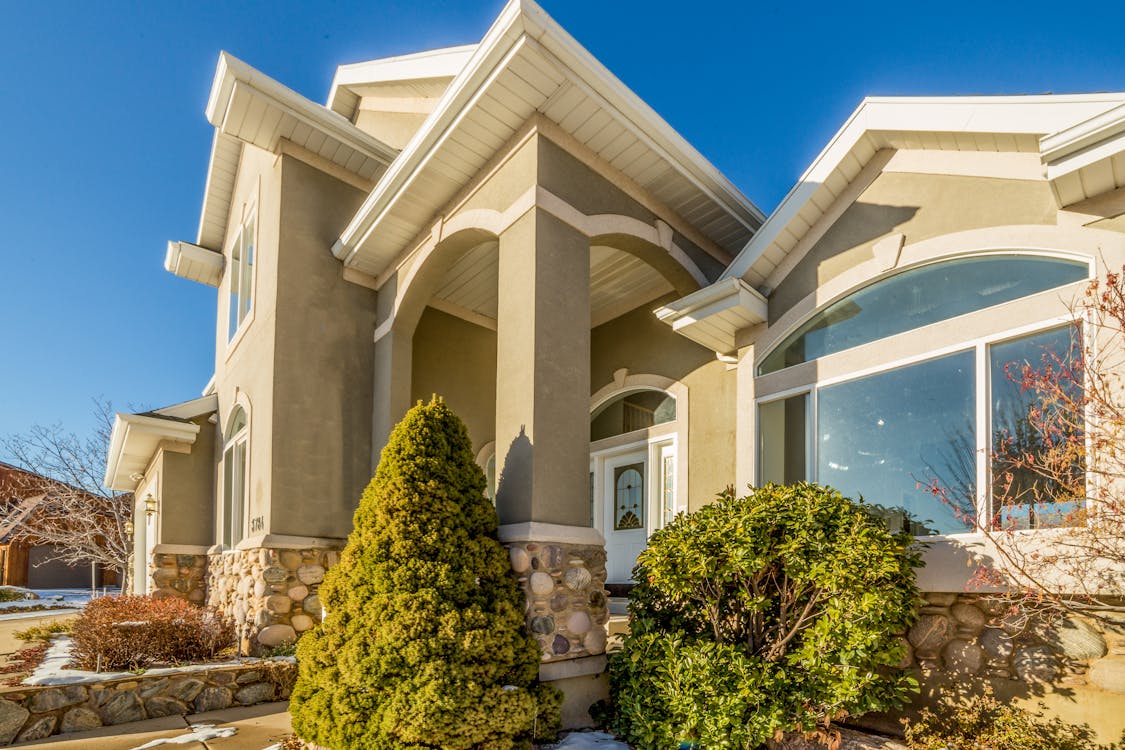 Well-maintained suburban home with sparkling clean windows enhancing curb appeal