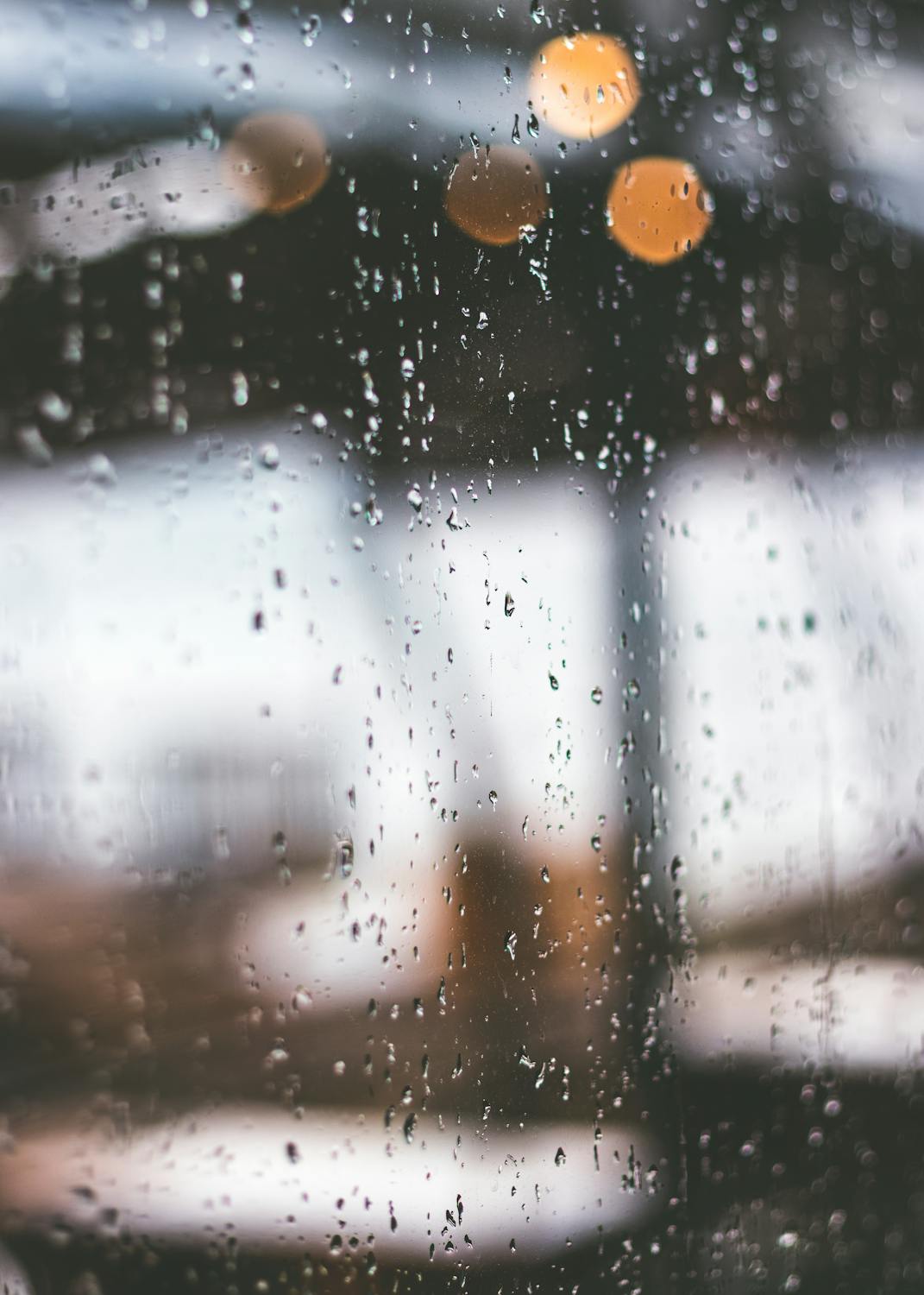 Storm debris and rain on residential windows after severe weather
